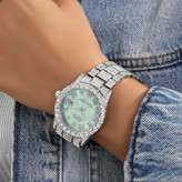 ساعت مچی زنانه طرح رولکس Rolex قفل پروانه ای فول نگین کار شده سیلور تقویم دار رنگ ثابت کد zmp (پس کرایه)